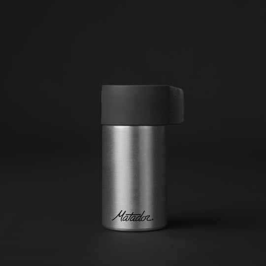 Front of canister on black background