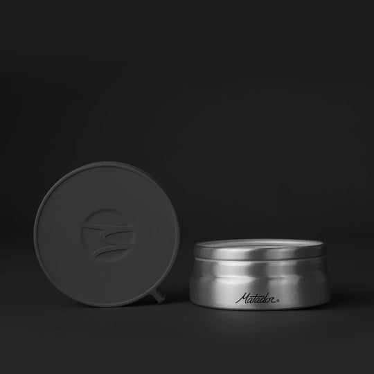 Large canister front on grey background