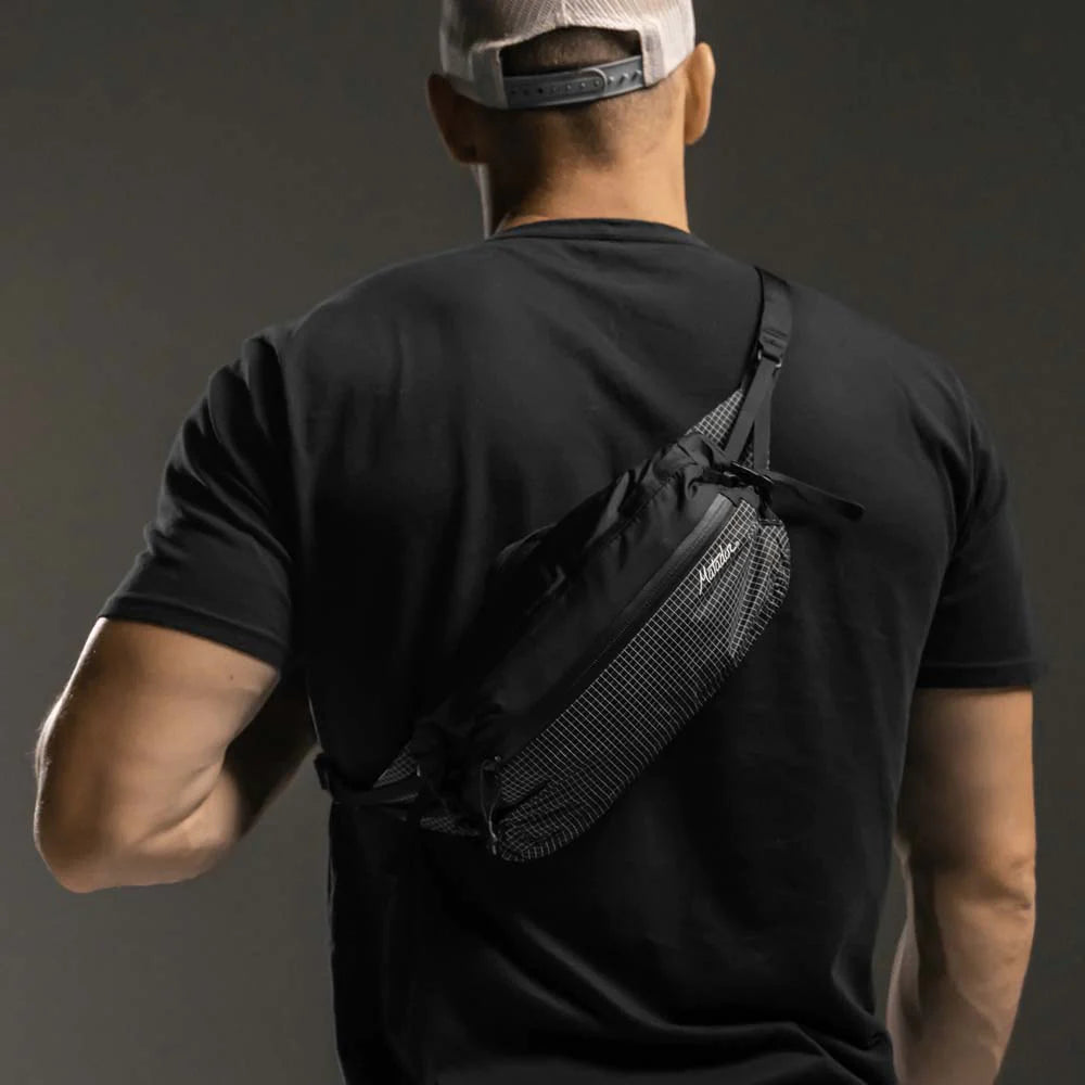 Man wearing hip pack across his back