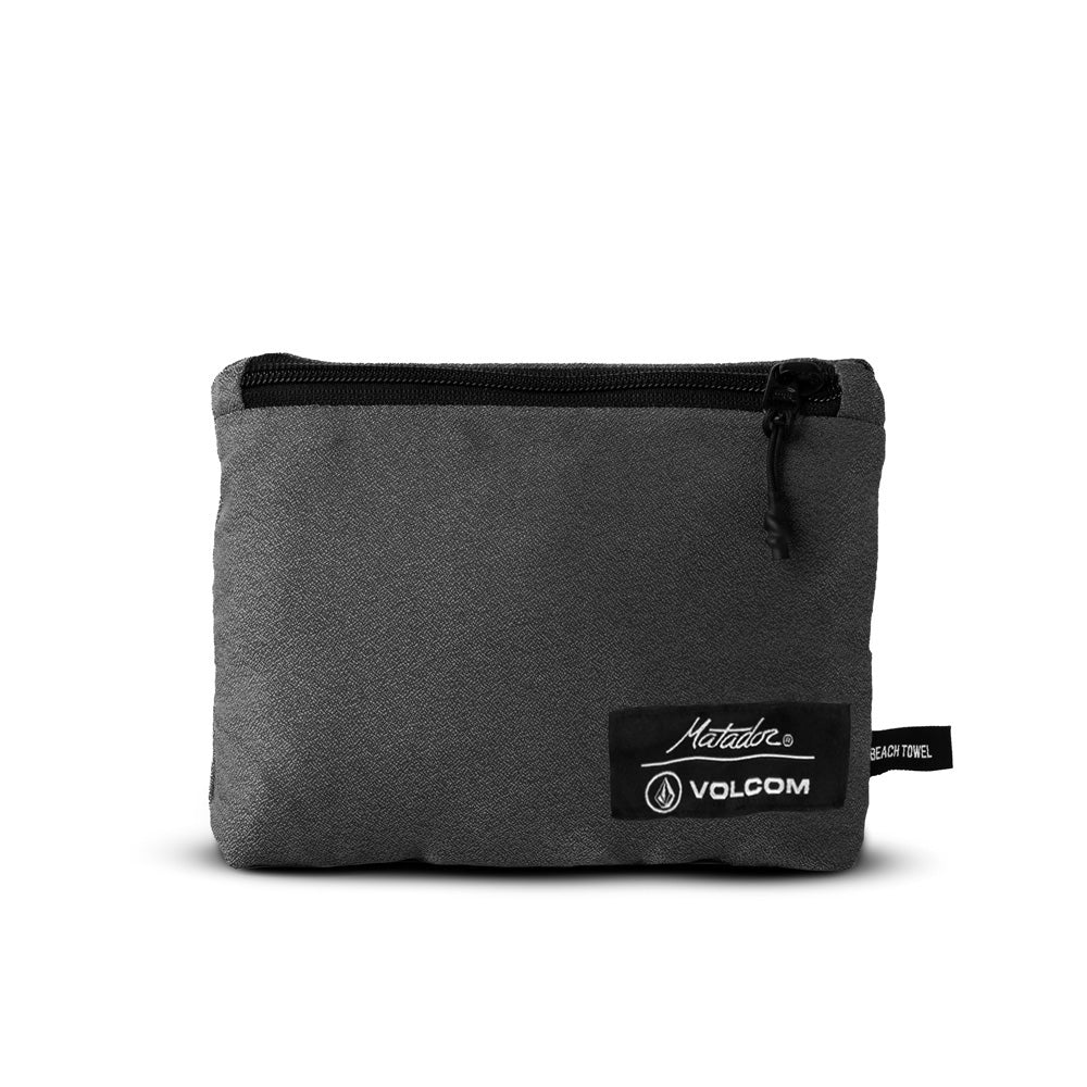 Packed up grey towel on white background