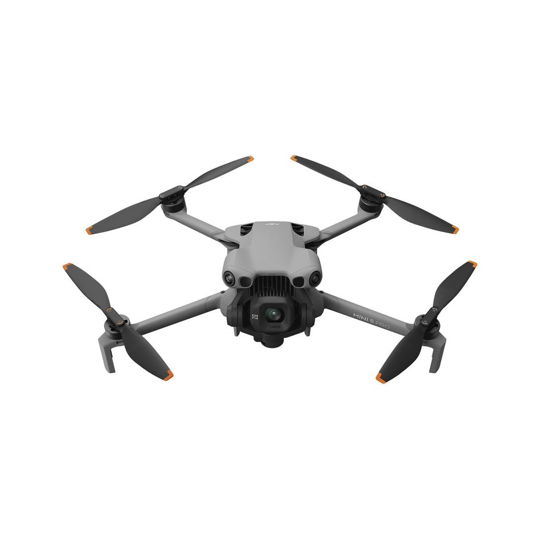 DJI Mini 5 Pro drone with four propellers on a white background