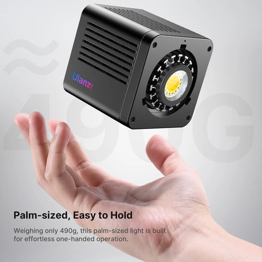 Palm-sized light held in a hand with 'Ulanzi' branding on a gray background
