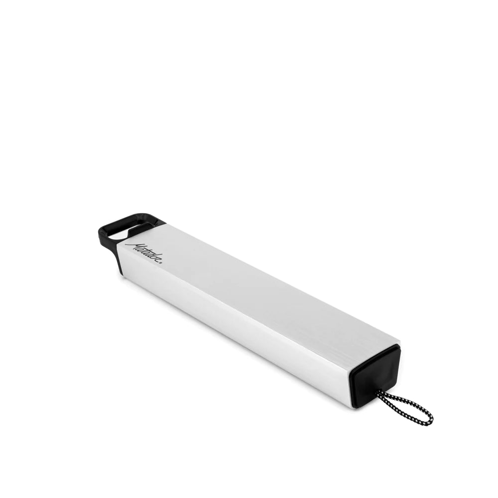 Angle shot of pill canister on white background