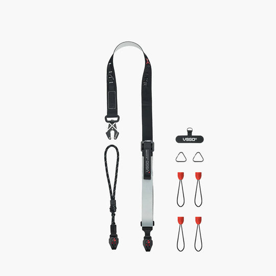 Camera strap with additional attachments on a white background