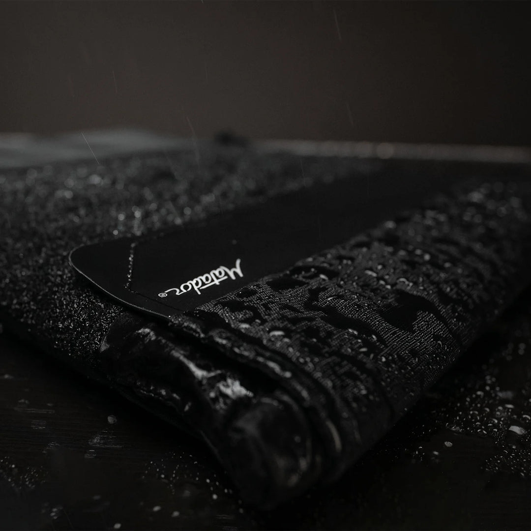 Close up view of Laptop base layer covered in beaded water