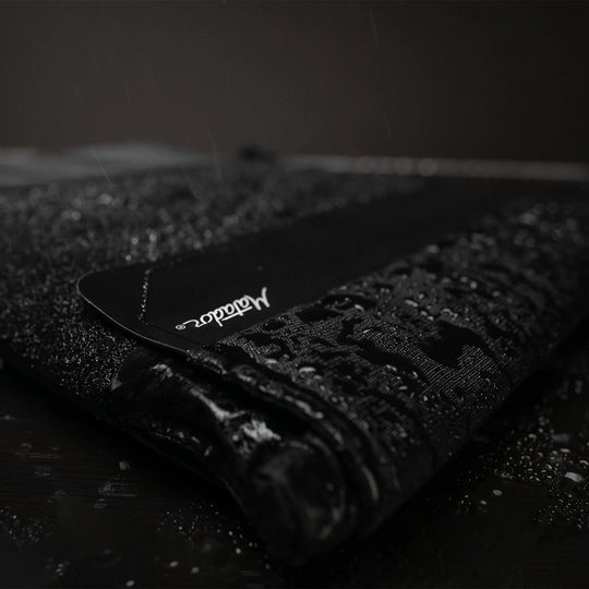 Close up view of Laptop base layer covered in beaded water