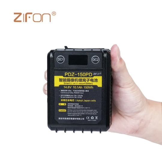A ZiFon PDZ-150PD 150Wh 14.8V V-mount battery in black color, designed for Aputure lighting equipment, held in a hand.