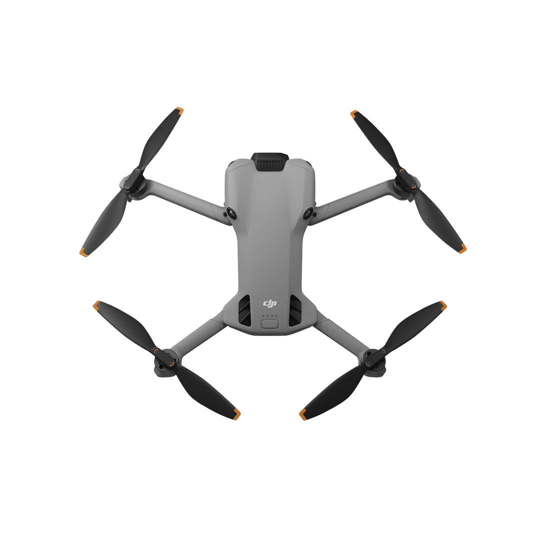 DJI Mini 5 Pro drone with four propellers on a white background