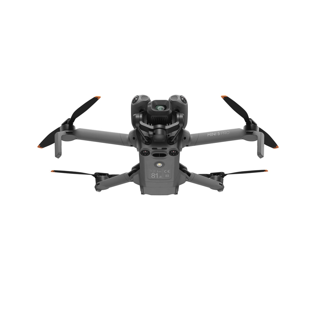 DJI Mini 5 Pro drone with propellers on a white background