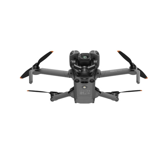 DJI Mini 5 Pro drone with propellers on a white background