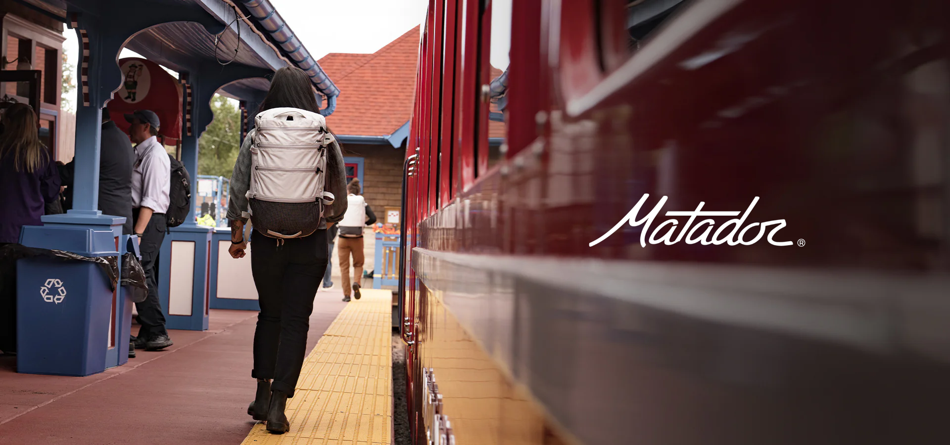 A girl with Matador SEG 28 backpack leaving the train station