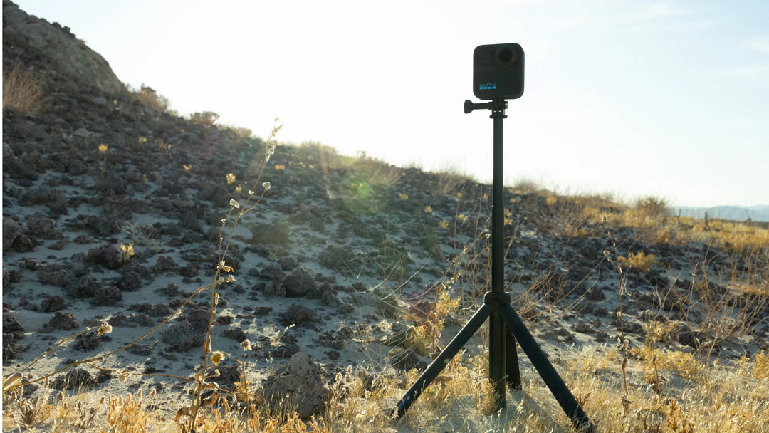 Camera on a tripod in a desert landscape