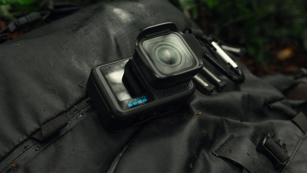 GoPro mission 1 Action camera on a black jacket with a blurred natural background