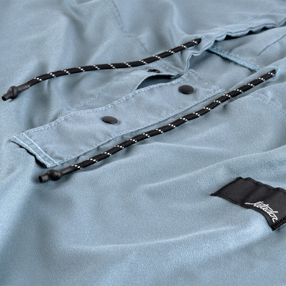 Light blue shirt with black drawstrings and a brand label on a light gray background