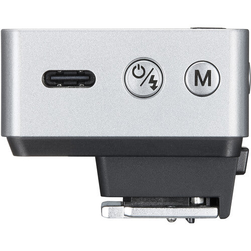 Silver electronic device with USB port and control buttons on a white background