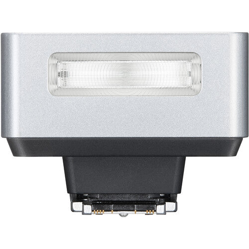 Silver and black flash unit on a white background