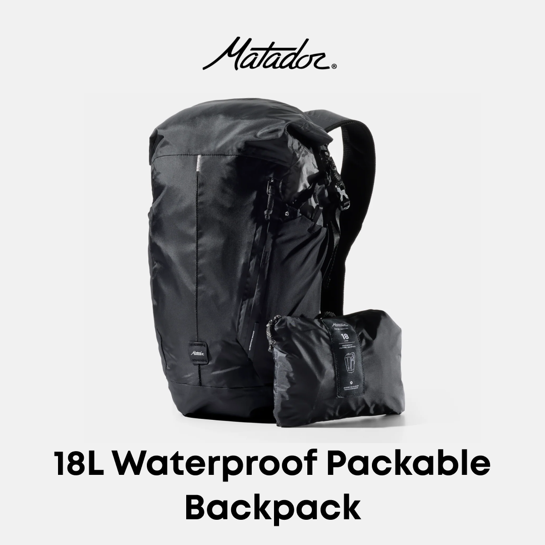 A black Matador 18L waterproof packable backpack shown standing upright with its matching packed pouch placed in front, on a light gray background with the Matador logo at the top and text reading &
