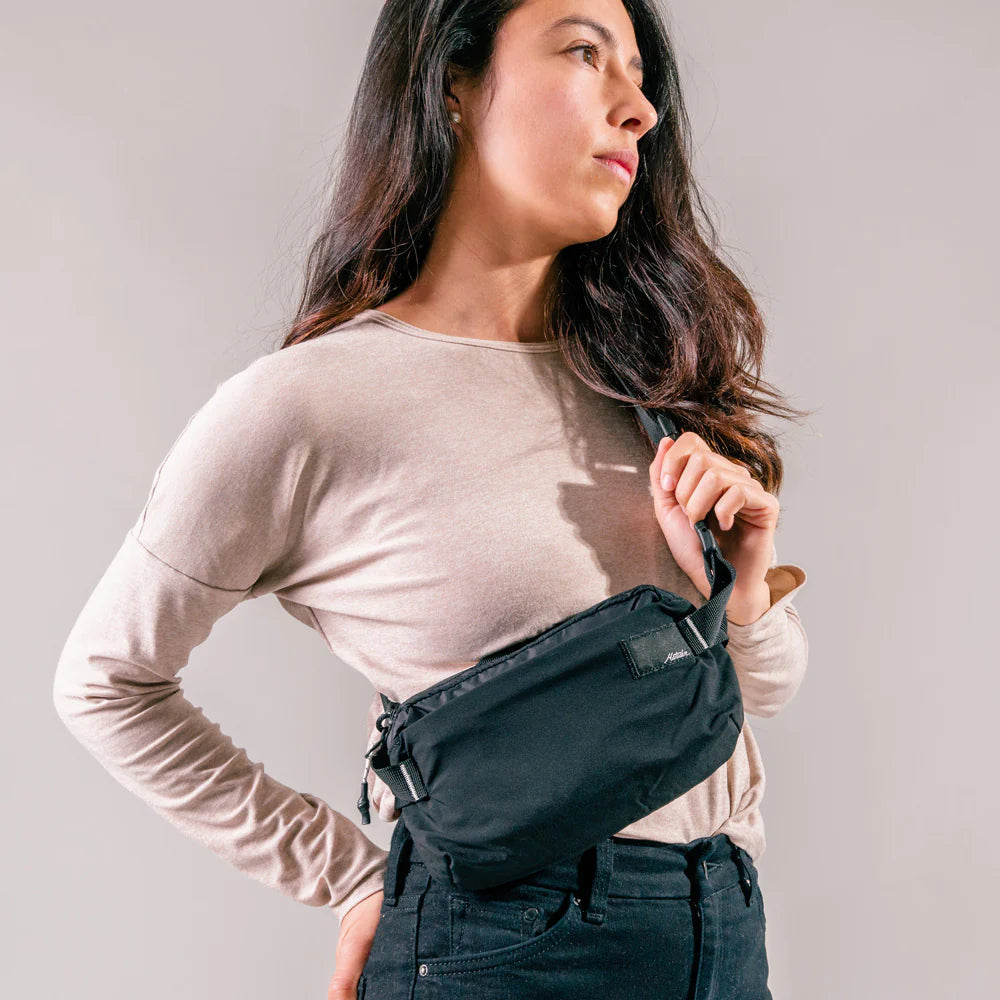 Three Matador ReFraction Packable Slings in black, blue, and gray, displayed in a front-facing arrangement with the Matador logo at the top.