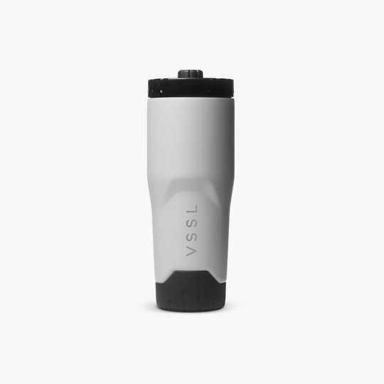 A VSSL insulated travel tumbler with a matte gray body and black lid/base, shown on a clean white background.