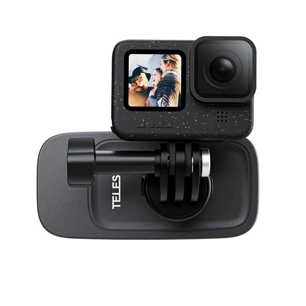 A black action camera shown from the front, mounted on a black Telesin bracket with its screen turned on displaying a photo.