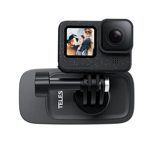 A black action camera shown from the front, mounted on a black Telesin bracket with its screen turned on displaying a photo.