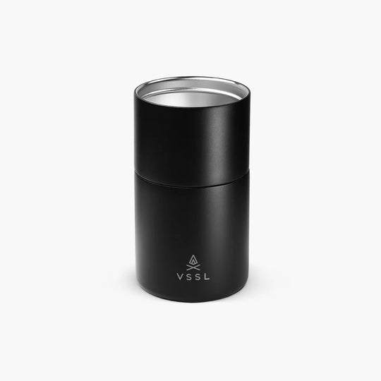 A matte black cylindrical VSSL container with a silver stainless steel rim at the top, shown on a clean white background.