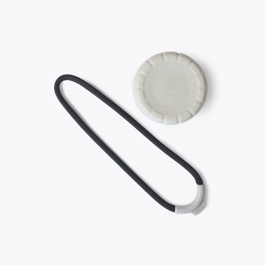 Black belt and white circular object on a white background