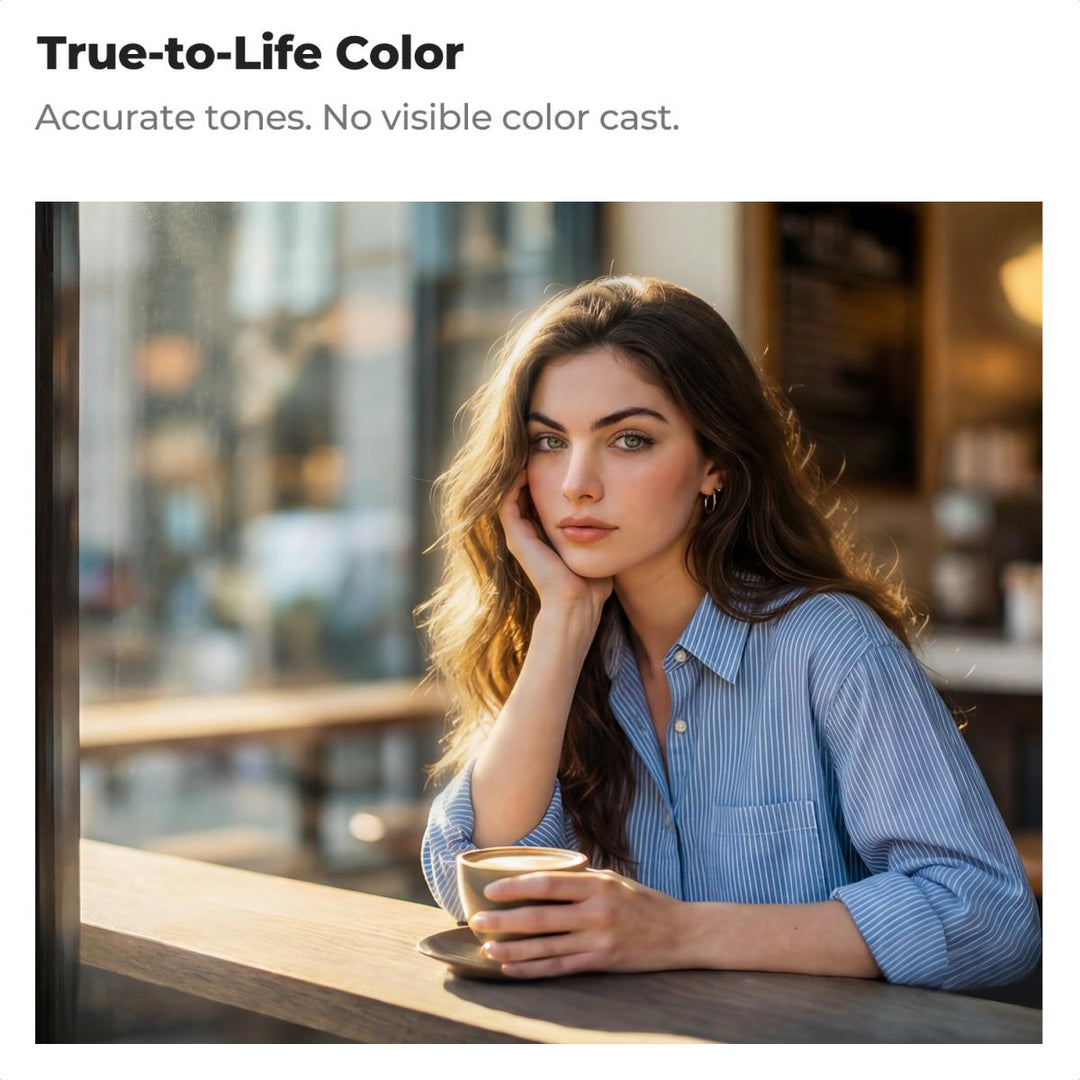 A woman with long wavy brown hair sits at a cafe table wearing a light blue and white striped button-down shirt, holding a coffee cup. The image is presented with marketing text at the top reading &
