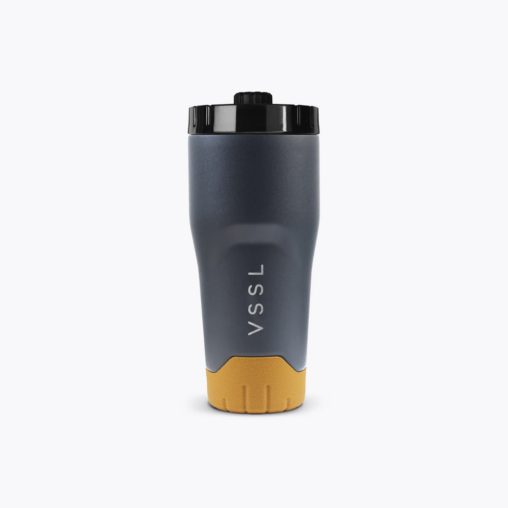 Gray and yellow travel mug with 'VSSL' branding on a white background