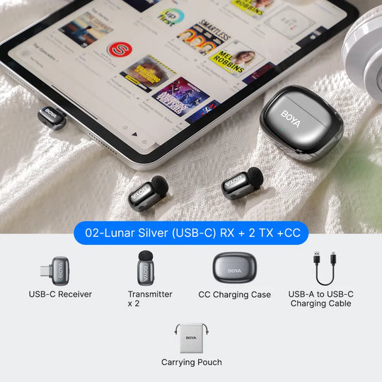 BOYA wireless microphone system with tablet displaying a news app on a white surface.