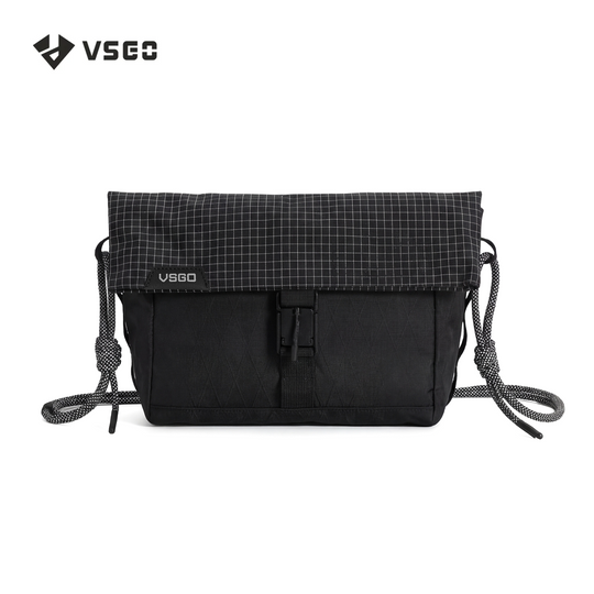 Black crossbody bag with grid pattern on top, featuring VSGO logo, on a white background