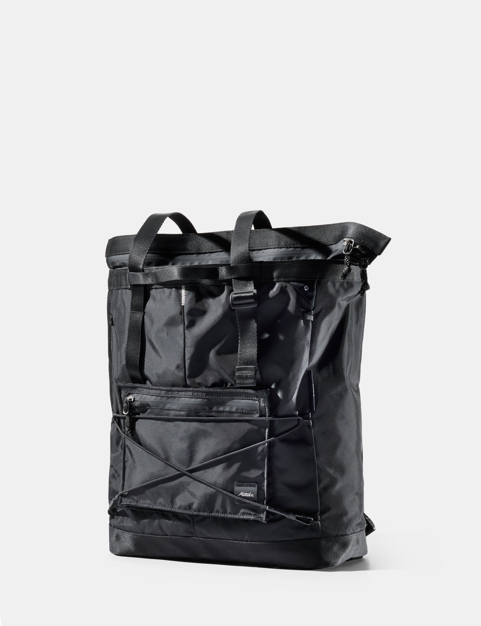 A black Matador 24L Tote Pack backpack shown on a light gray background with the Matador logo at the top and '24L Tote Pack' text at the bottom.