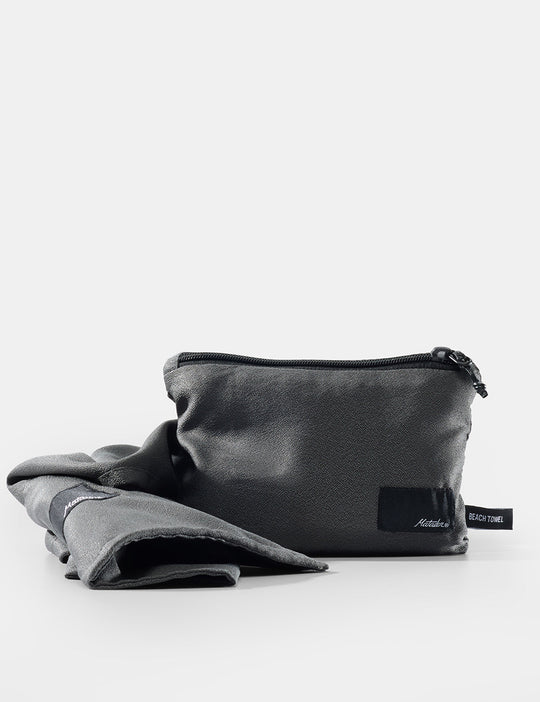 Black pouch with a folded gray fabric on a white background