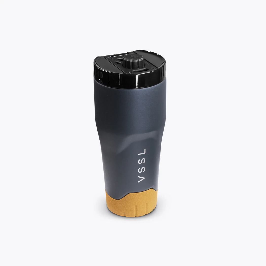 Black and gold travel mug with &
