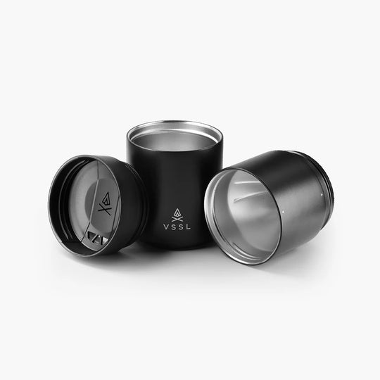 Black and silver insulated tumblers with VSSL logo on a white background