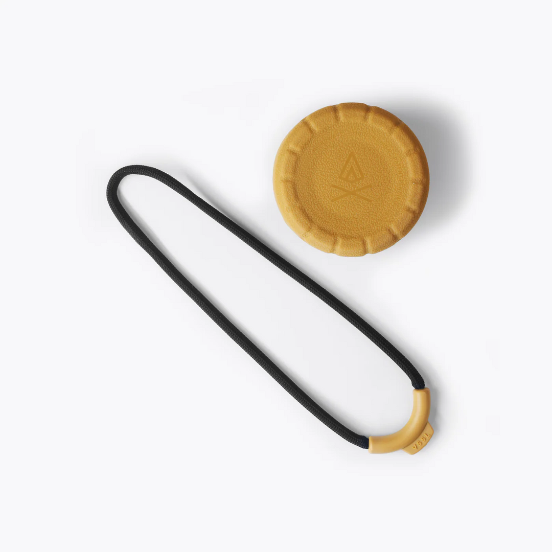 Black and yellow strap with a circular yellow pad on a white background