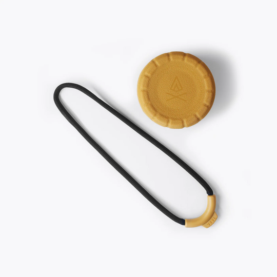 Black and yellow strap with a circular yellow pad on a white background
