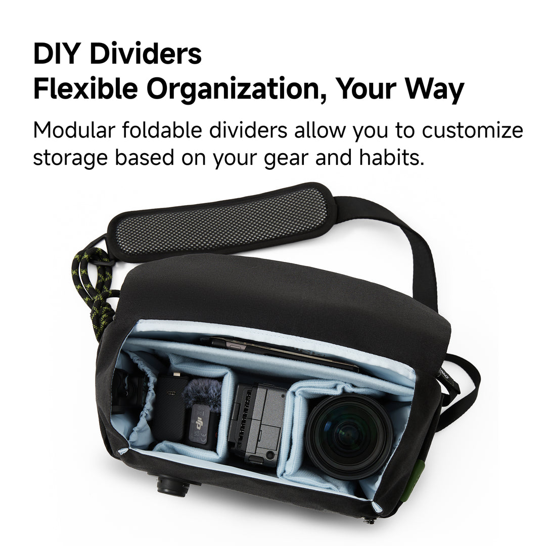 Black bag with modular foldable dividers for flexible organization on a white background