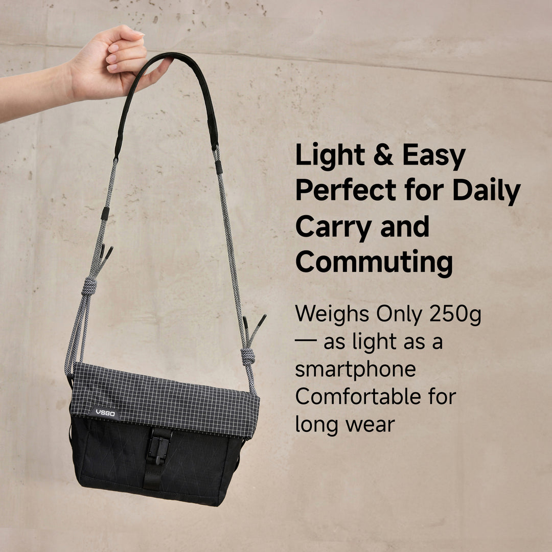 Black shoulder bag held by a hand with promotional text on a beige background