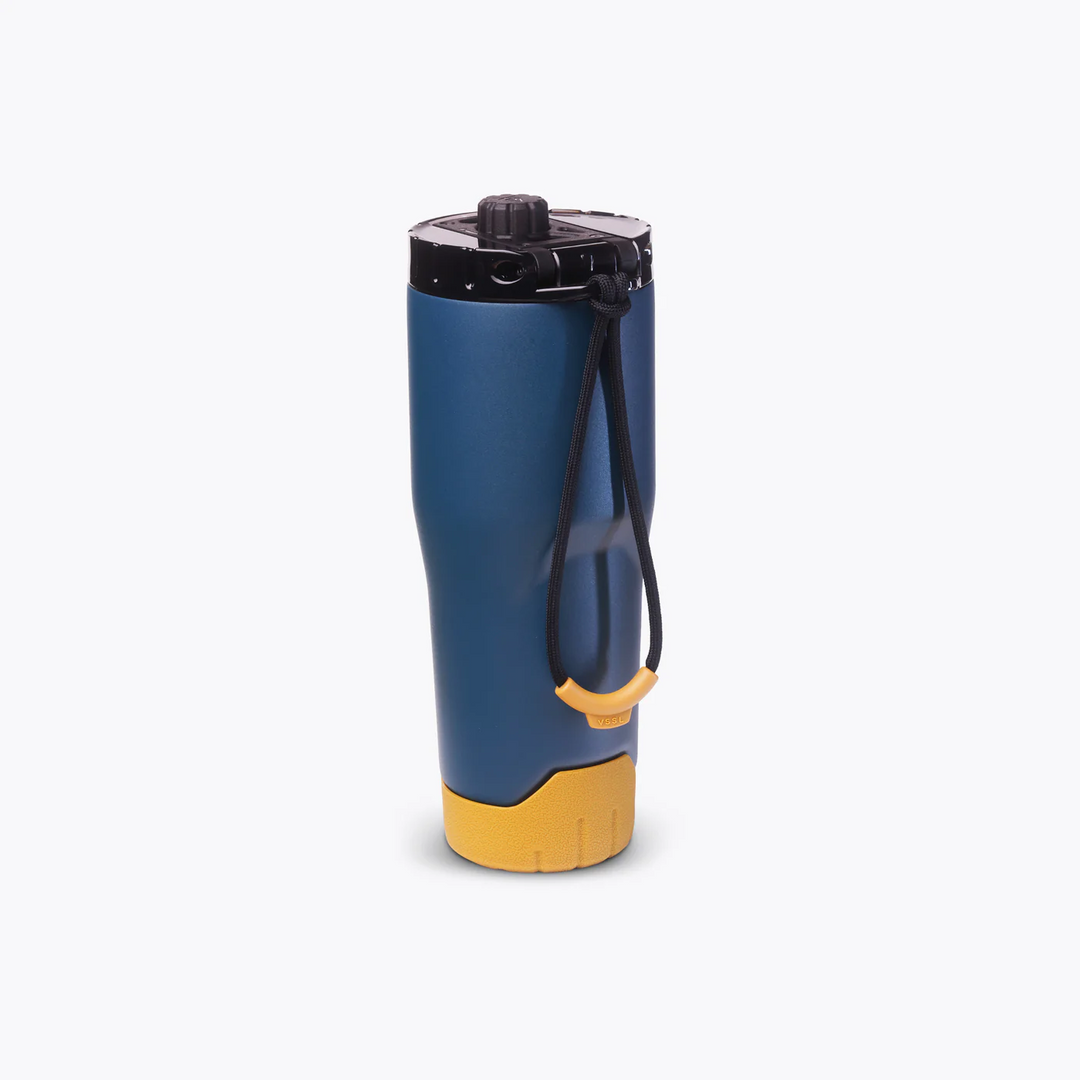 Blue and yellow water bottle with black cap on a white background
