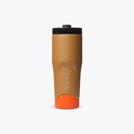 Brown and orange tumbler with &