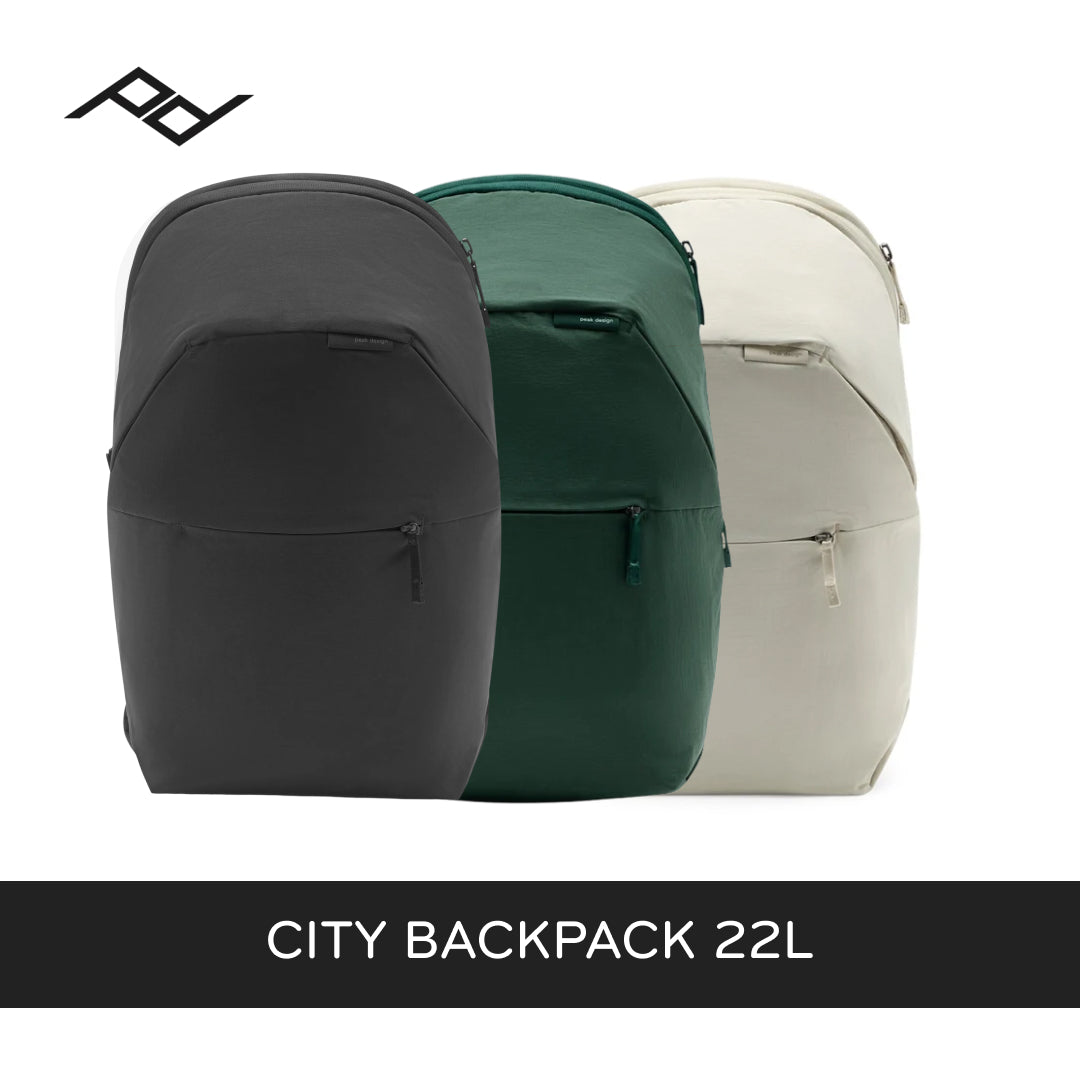 Three backpacks shown side by side on a white background: a black one in front, a dark green one in the middle, and a light beige/cream one behind. A black brand logo appears in the top left, and a black banner at the bottom reads &
