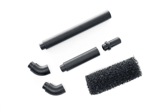 Set of black vacuum attachment parts on a white background