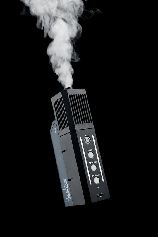 PMI SmokeNINJA PRO - Handheld Fog Machine emitting white smoke on a black background
