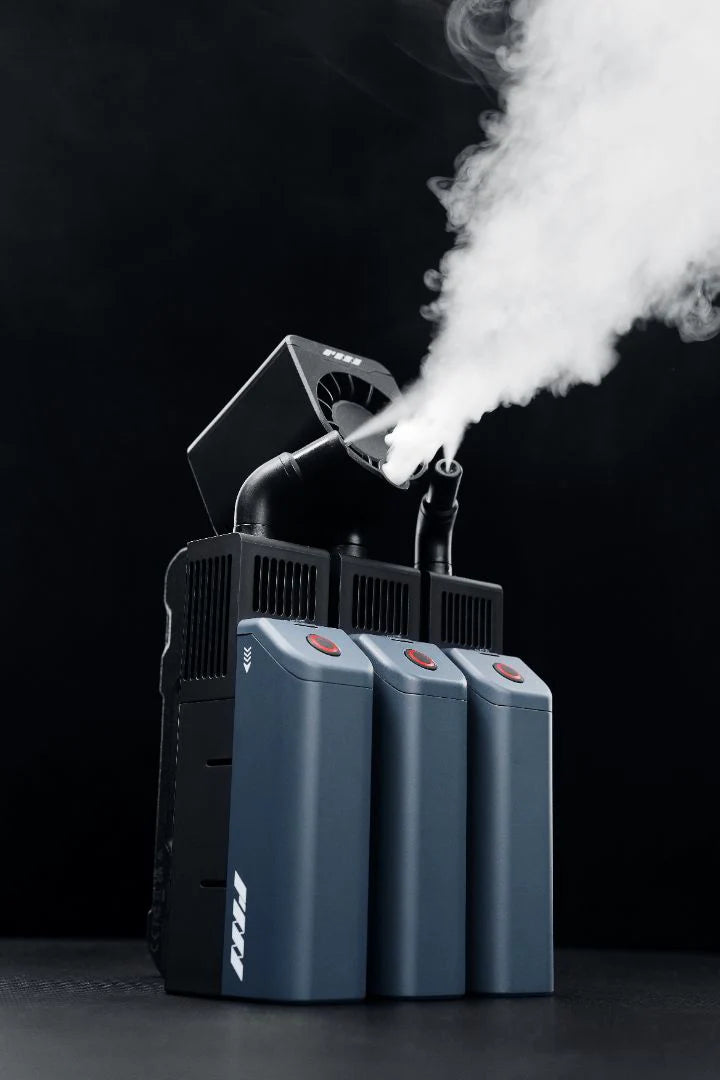 PMI SmokeNINJA PRO - Handheld Fog Machine emitting smoke against a dark background