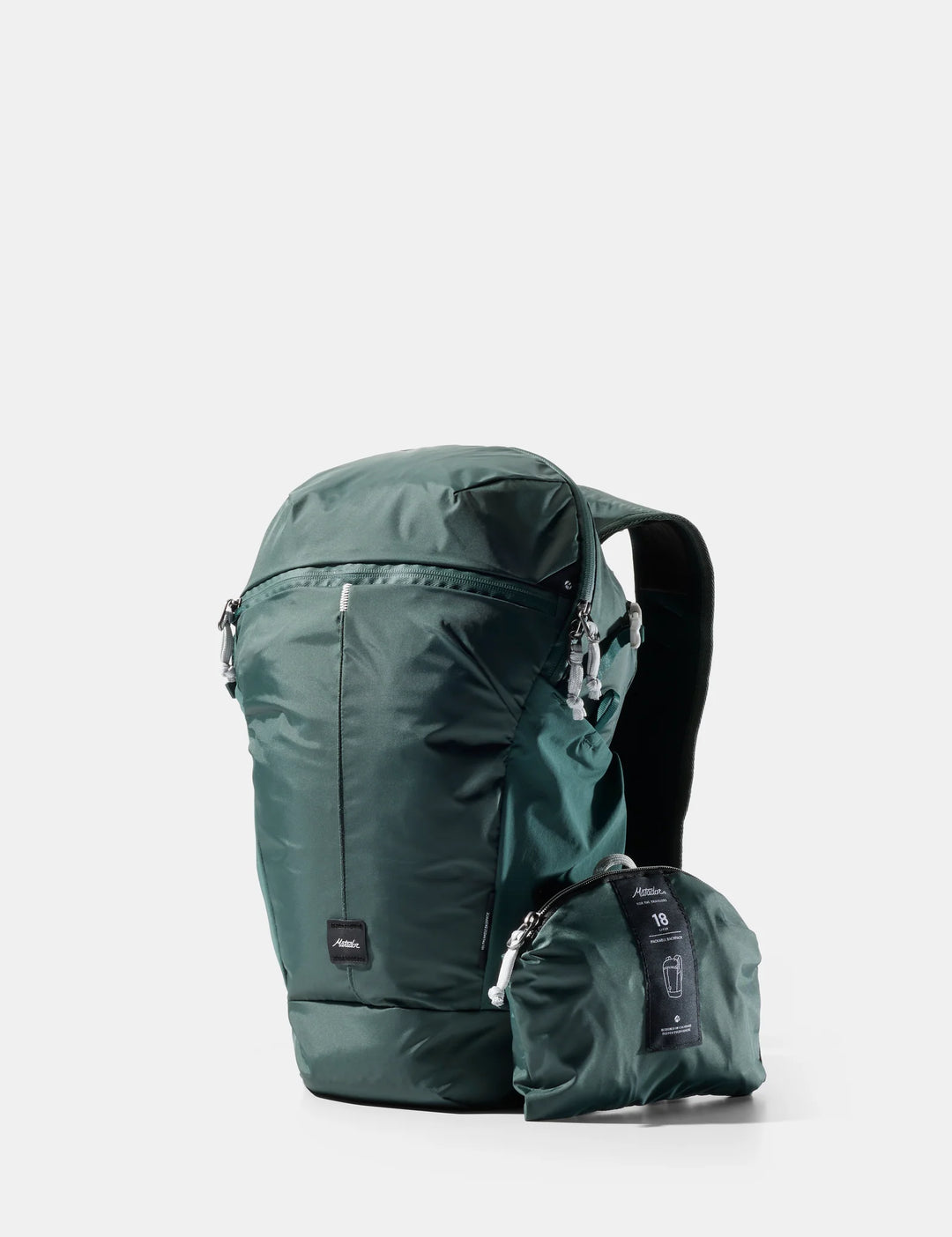 A dark green waterproof backpack shown next to its matching compact zippered carrying pouch on a light gray background.