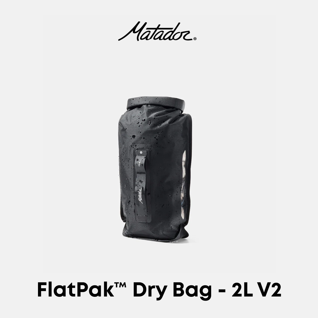 Matador FlatPak Dry Bag 2L V2 in black, shown against a light gray background with the Matador logo at the top and product name at the bottom.