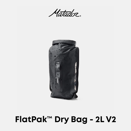 Matador FlatPak Dry Bag 2L V2 in black, shown against a light gray background with the Matador logo at the top and product name at the bottom.