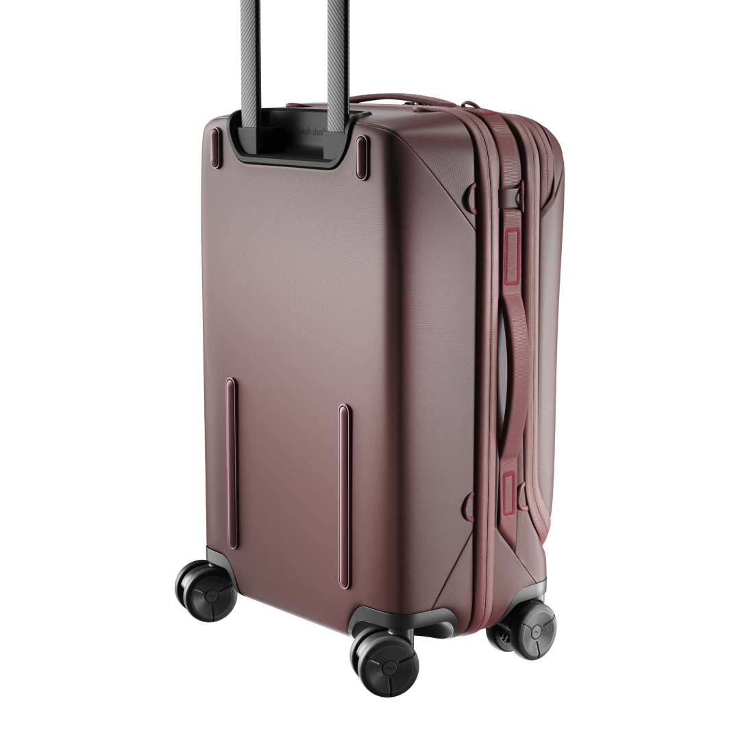 Brown suitcase with wheels on a white background