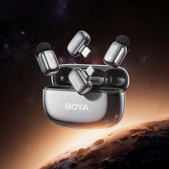BOYA wireless microphone system with clear case against a space-themed background